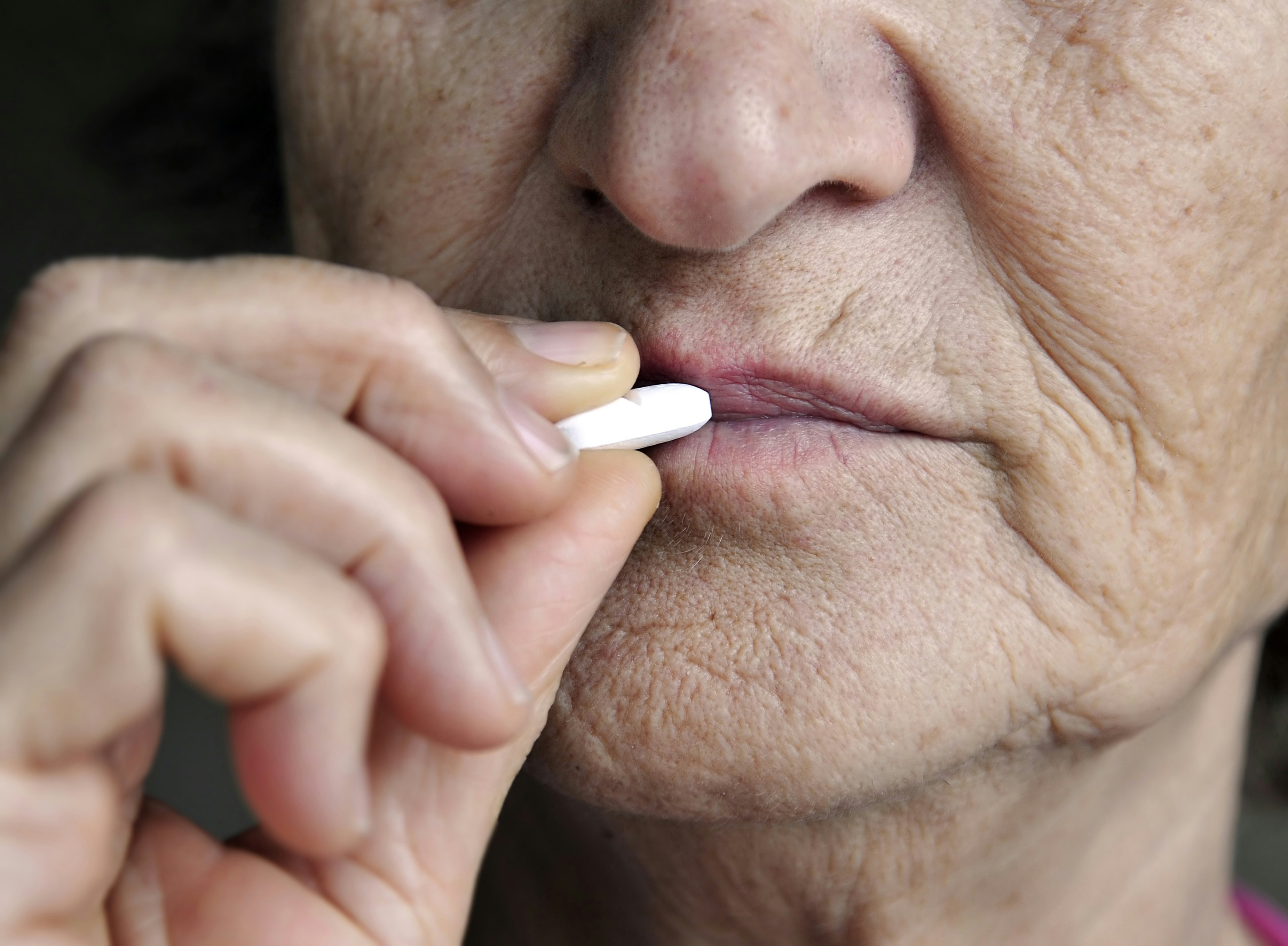 Elder person taks medication