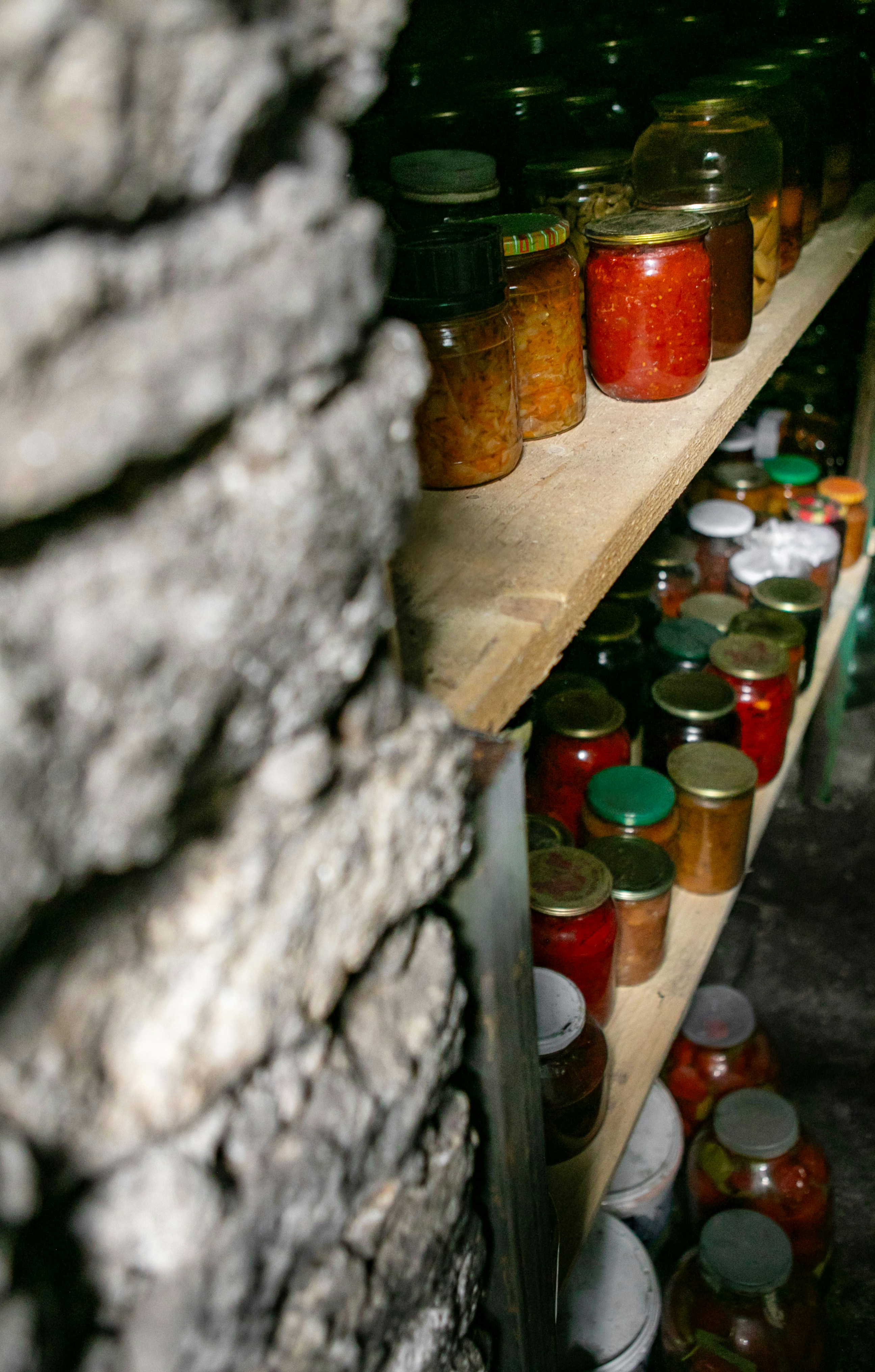 Pantry full of jars with preserved food