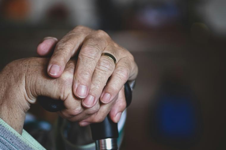 Hand holding cane