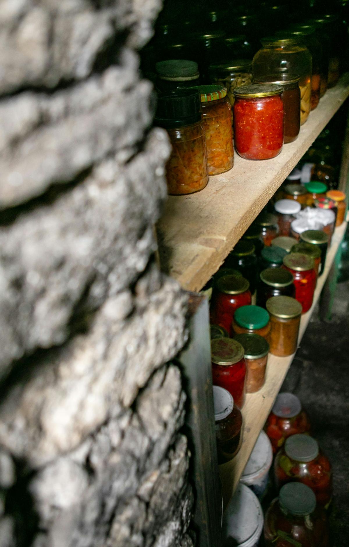 Pantry full of jars with preserved food
