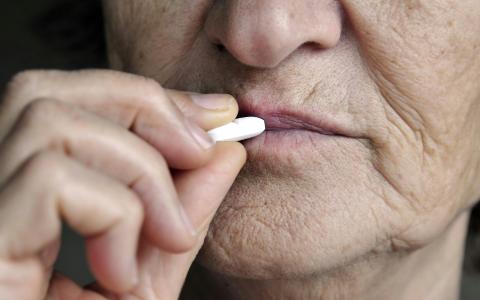 Elder person taks medication