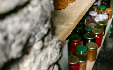 Pantry full of jars with preserved food